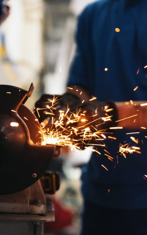 Professional Mechanic Repairing Car Engine in Garage.
